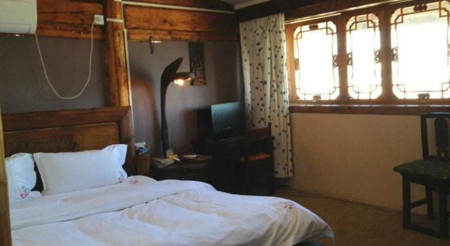 Courier Inn Lijiang, Забронировать Отель Лицзян Юньнань, рядом с Улица Сквер-стрит Древнего города Даянь