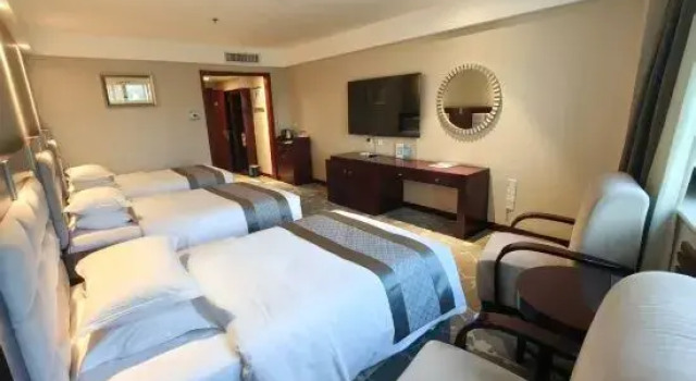 Кровать в общем номере Qing Hua Hotel