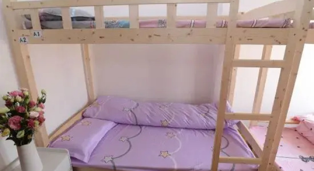 Кровать в общем номере Nanning Yuewanwan Homestay (Guangxi University Xiuling Road Subway Station)