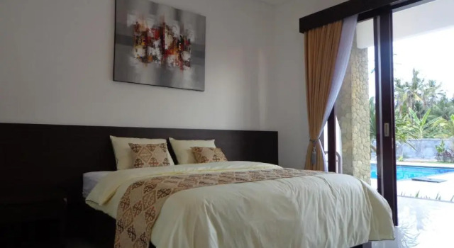 Двухместный номер Deluxe с видом на бассейн D Kubu Pratama Homestay
