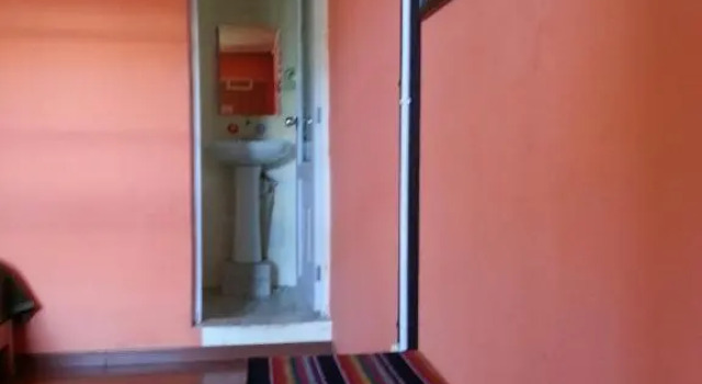 Кровать в общем номере Kevin's Trekker Inn