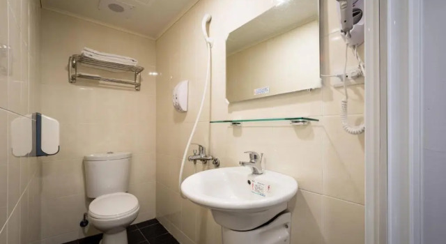 Кровать в общем номере Wish Hotel