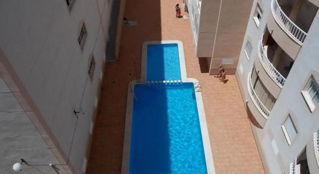 apartamento soleado, 1 dormitorio con balcón, piscina y garage, Забронировать Апартаменты/квартира Отели Торревьеха с парковкой, рядом с Городской театр Торревьехи, Парковка