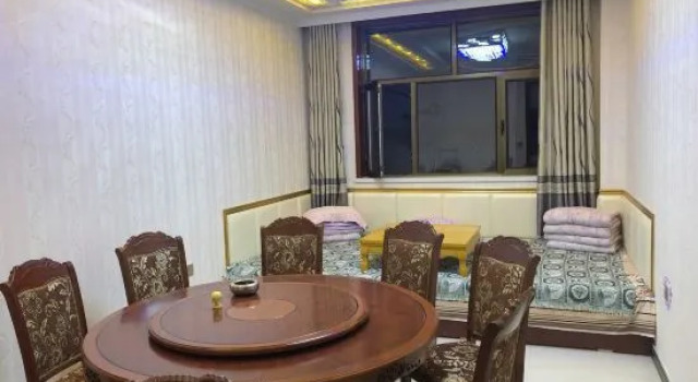Кровать в общем номере New East Asia Hotel