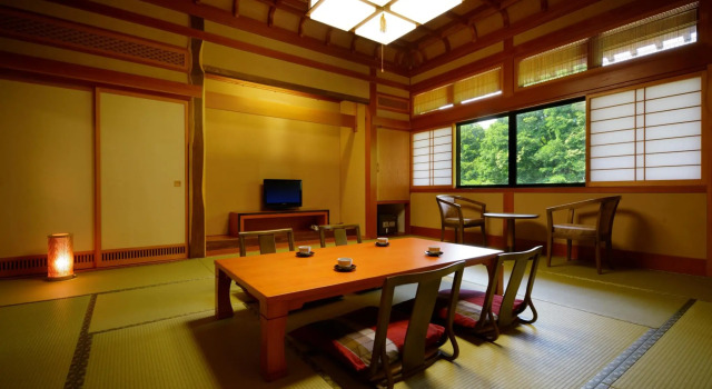 Кровать в общем номере Yamanokami Onsen Yuukaen