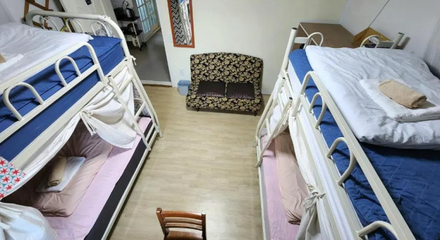Cama en dormitorio compartido Aark House