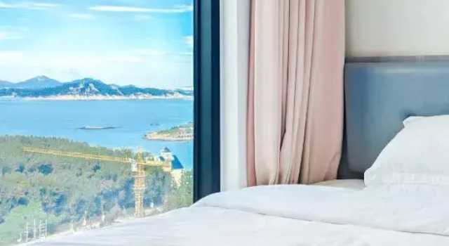Кровать в общем номере Xile Seaview Homestay (Nanyu Shuangmianhai Branch)