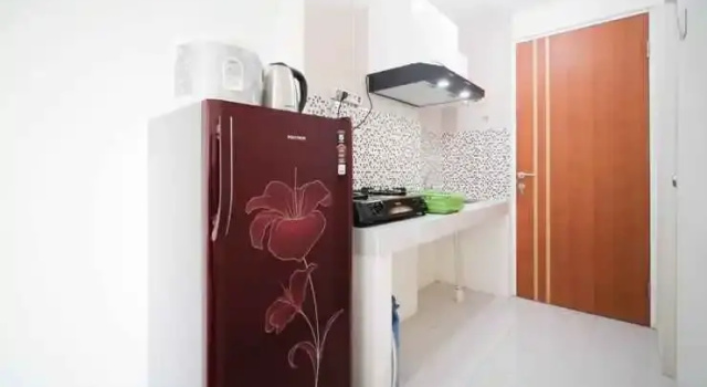 Tidy and Compact Studio at Puncak Dharmahusada Apartment By Travelio