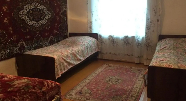 Кровать в общем номере Olya Guest house