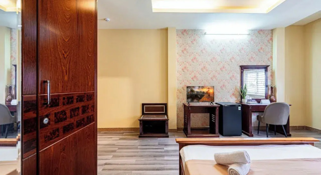 Номер Deluxe Hoàng Long Hotel By Cozrum