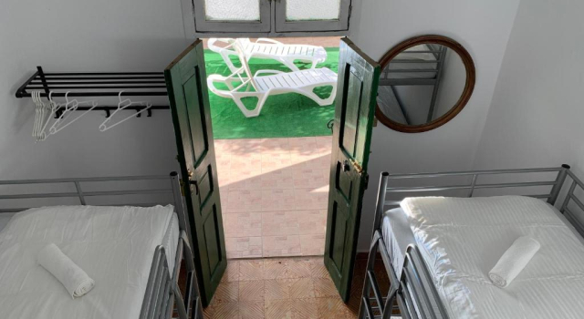 Кровать в общем номере La Casita