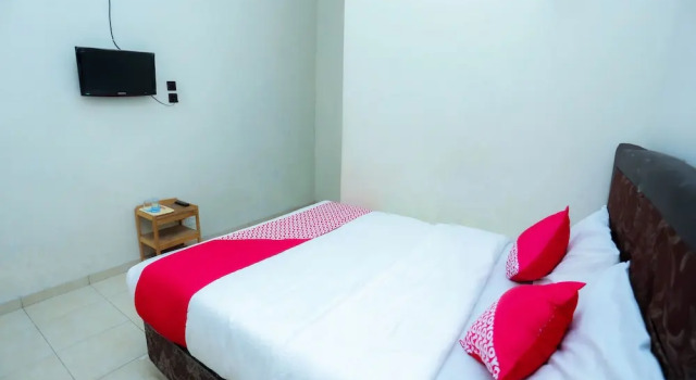 Номер Deluxe OYO 2692 Penginapan Mba Ros