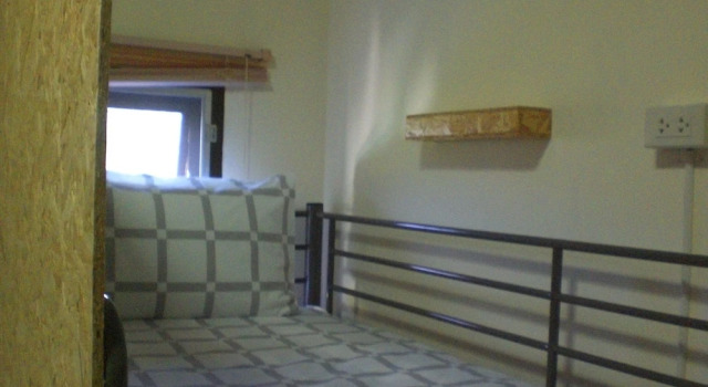 Кровать в общем номере JR Siam Inn Resort