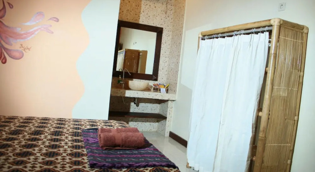Camera doppia Deluxe con balcone Hostel 1001 Malam Malioboro