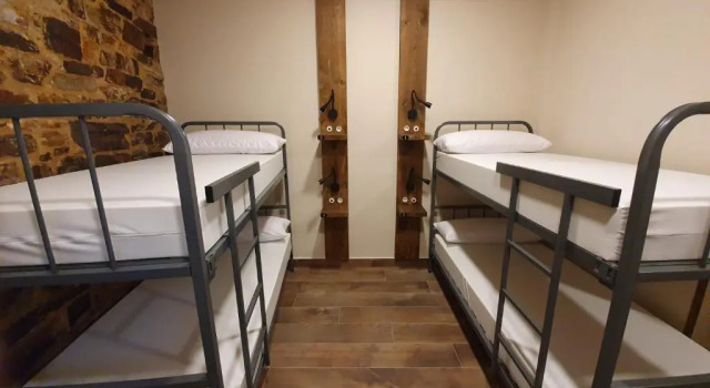 Кровать в общем номере Albergue Casa Cuartel