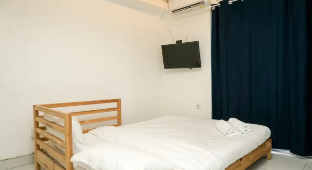 Simply White and Compact Studio at Amethyst Apartment