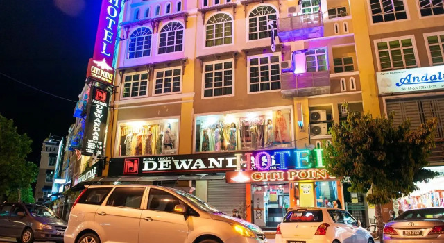 Кровать в общем номере DJ Citi Point Hotel