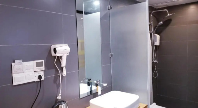 Łóżko w pokoju wieloosobowym Fengma Feiyang Hostel