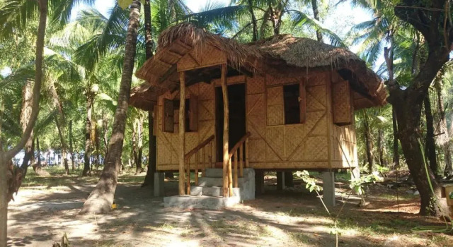 Кровать в общем номере Sablayan Paraiso Beach Resort