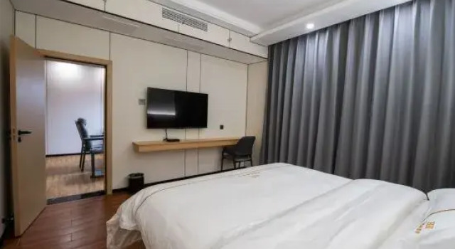 Люкс Junyi Business Hotel (Jishou Private Community Building Materials Home Furnishing Exhibition Center)