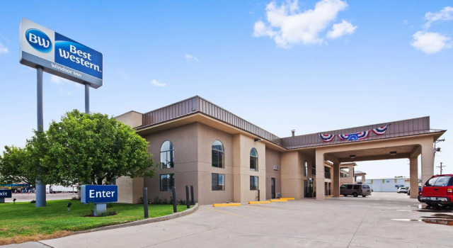Кровать в общем номере Best Western Windsor Inn