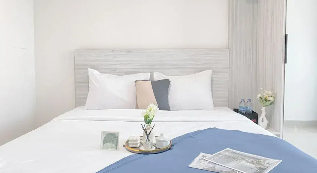 Simple White Designed Studio At Lrt City Bekasi Apartment