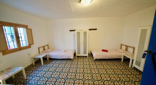 Кровать в общем номере Sol y Mar Surf Camp