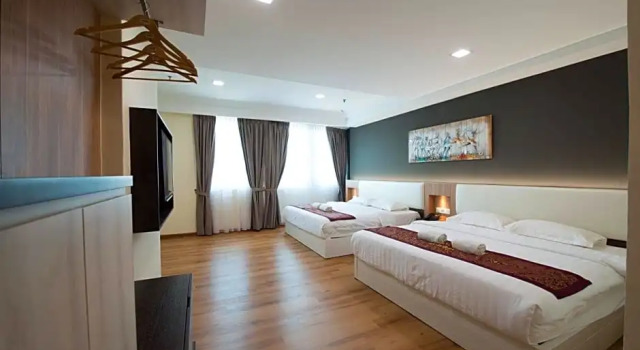 Четырёхместный семейный люкс Collection O Hotel Super Cowboy