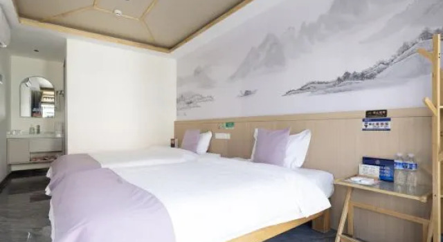 Кровать в общем номере Linyi Wuzhou Hotel