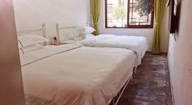Łóżko w pokoju wieloosobowym Senhuxi Hostel