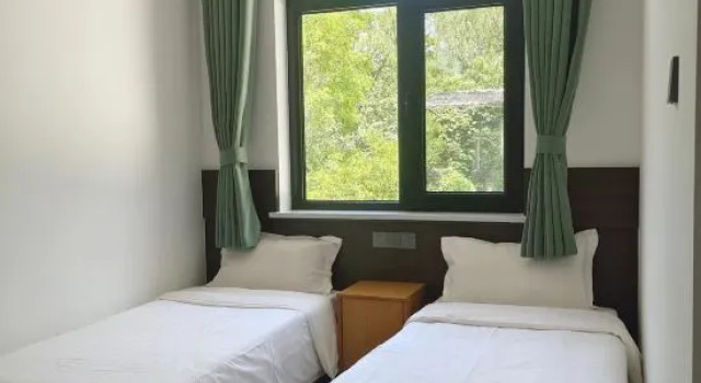 Кровать в общем номере Beijing Shentangxuan Tianlun Shengyuan Resort