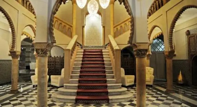 Кровать в общем номере с видом на город La Tour Hassan Palace