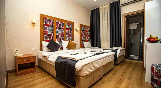 Трёхместный номер Deluxe La Pazza Suites