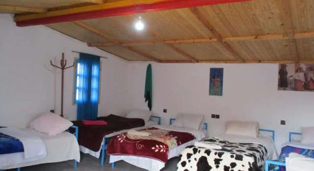 Кровать в общем номере Le Retour au calme Maison dhôtes