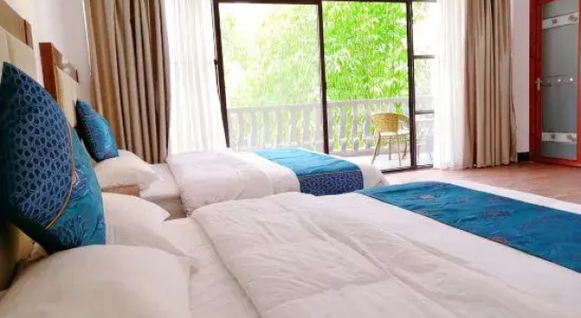Кровать в общем номере Guilin Guzhen Inn (Dawei Guzhen Inn)