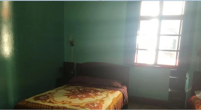 Кровать в общем номере Hostal La Chorrera