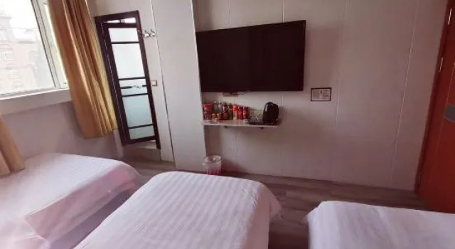 Кровать в общем номере Yecheng Jinsha Business Hotel