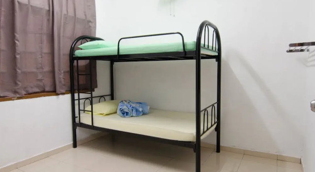 Кровать в общем номере Anggerik Residence