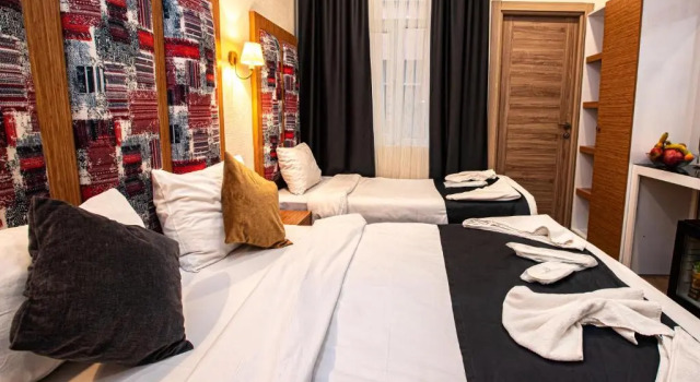 Трёхместный номер Deluxe La Pazza Suites