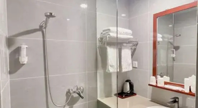 Bett im Wohnheim Sihai Hotel