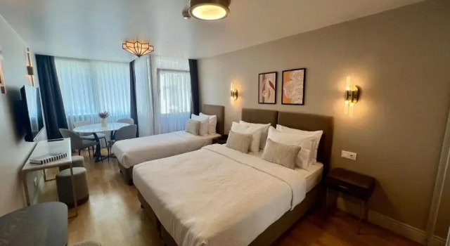 Superior Driepersoonskamer Weingart Suites Hotel