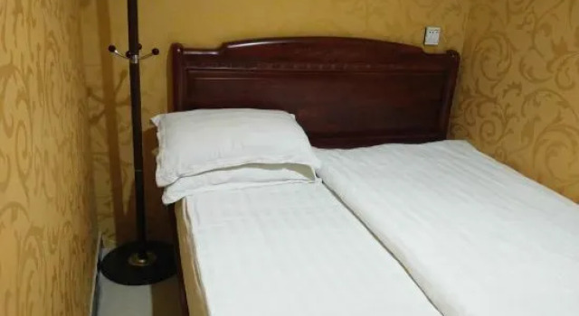 Кровать в общем номере Wang Qingxin Gold Hotel
