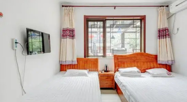Кровать в общем номере Jingxinju Inn (Beijing Miyun Old Town)