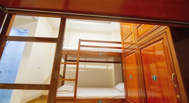 Кровать в общем номере Green Hotel Quy Nhơn