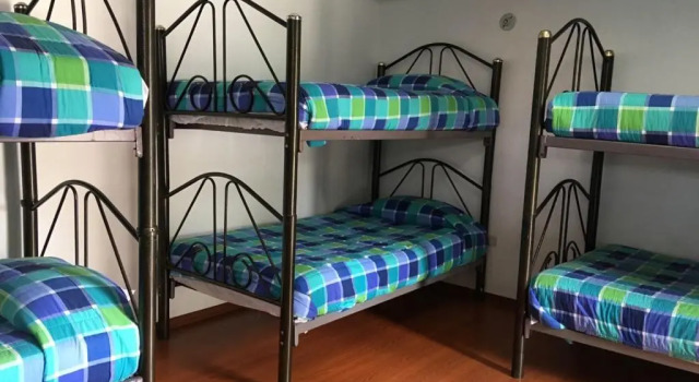 Кровать в общем номере Hosteria San Carlos Tababela