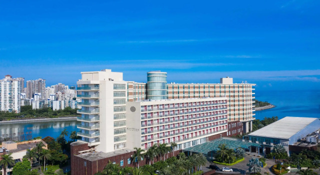 Łóżko w pokoju wieloosobowym Howard Johnson New Port Resort Haikou