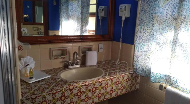 Кровать в общем номере Hotel Posada Quinta Las Flores