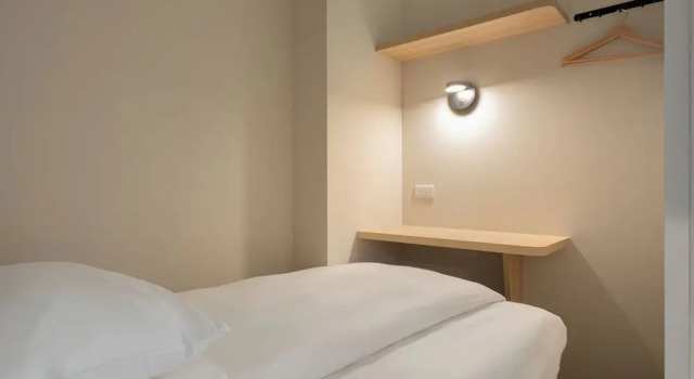 Кровать в общем номере Timios Inn 提米好旅