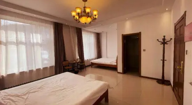 Кровать в общем номере Yabuli Qingyun County Xin Ding Apartment Hotel