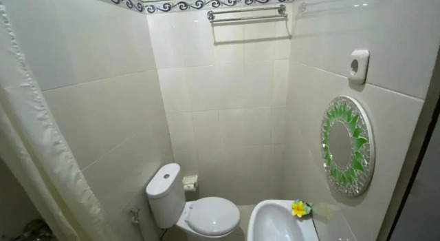 Кровать в общем номере Suwardika Homestay & Dormitory